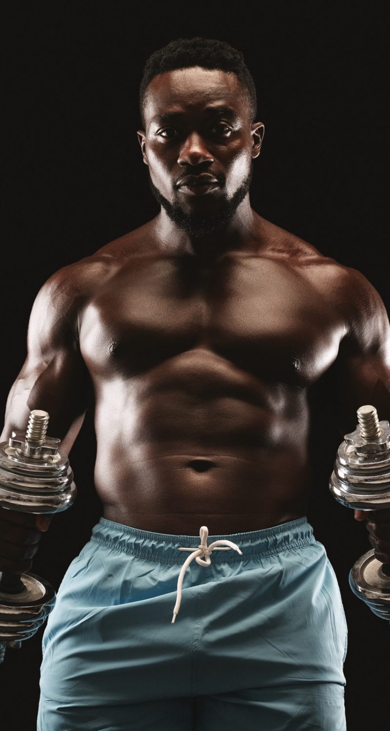 portrait-of-afro-bodybuilder-doing-workout-with-ba-DRKTPNQ.jpg